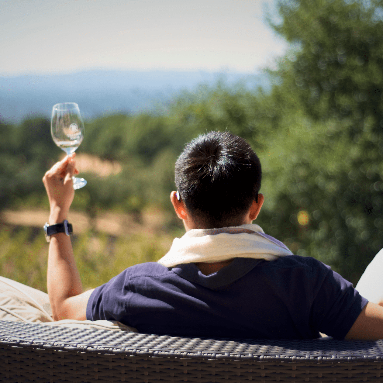 A man holding a glass of wine