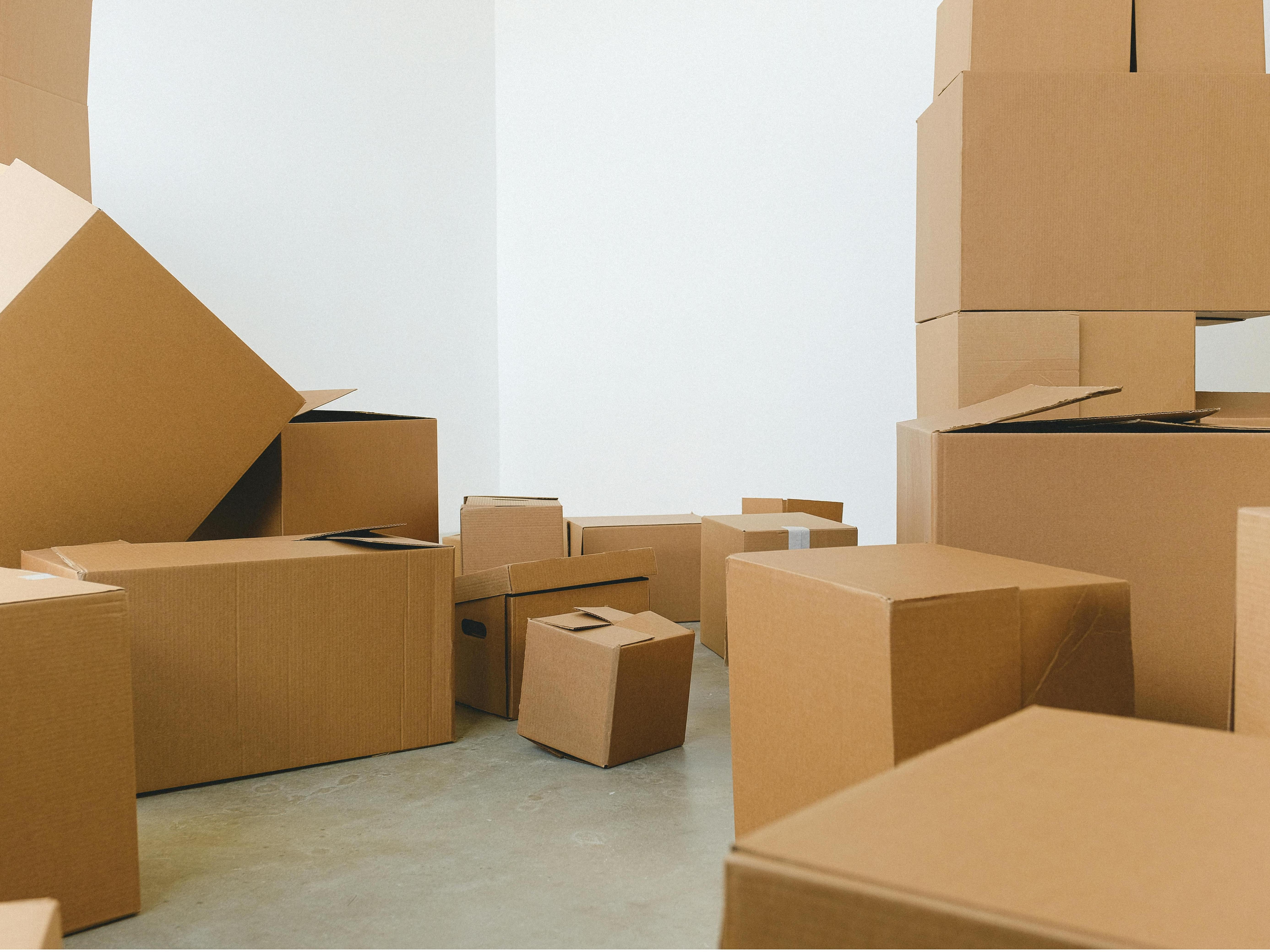 Stacked cardboard boxes in a minimalist warehouse setting