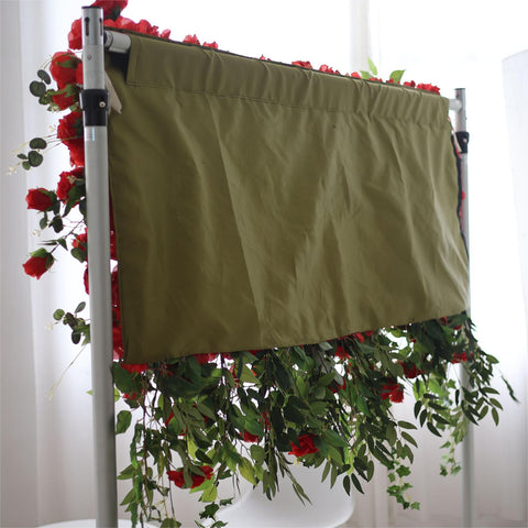 The red rose flower wall is fixed to a cloth.