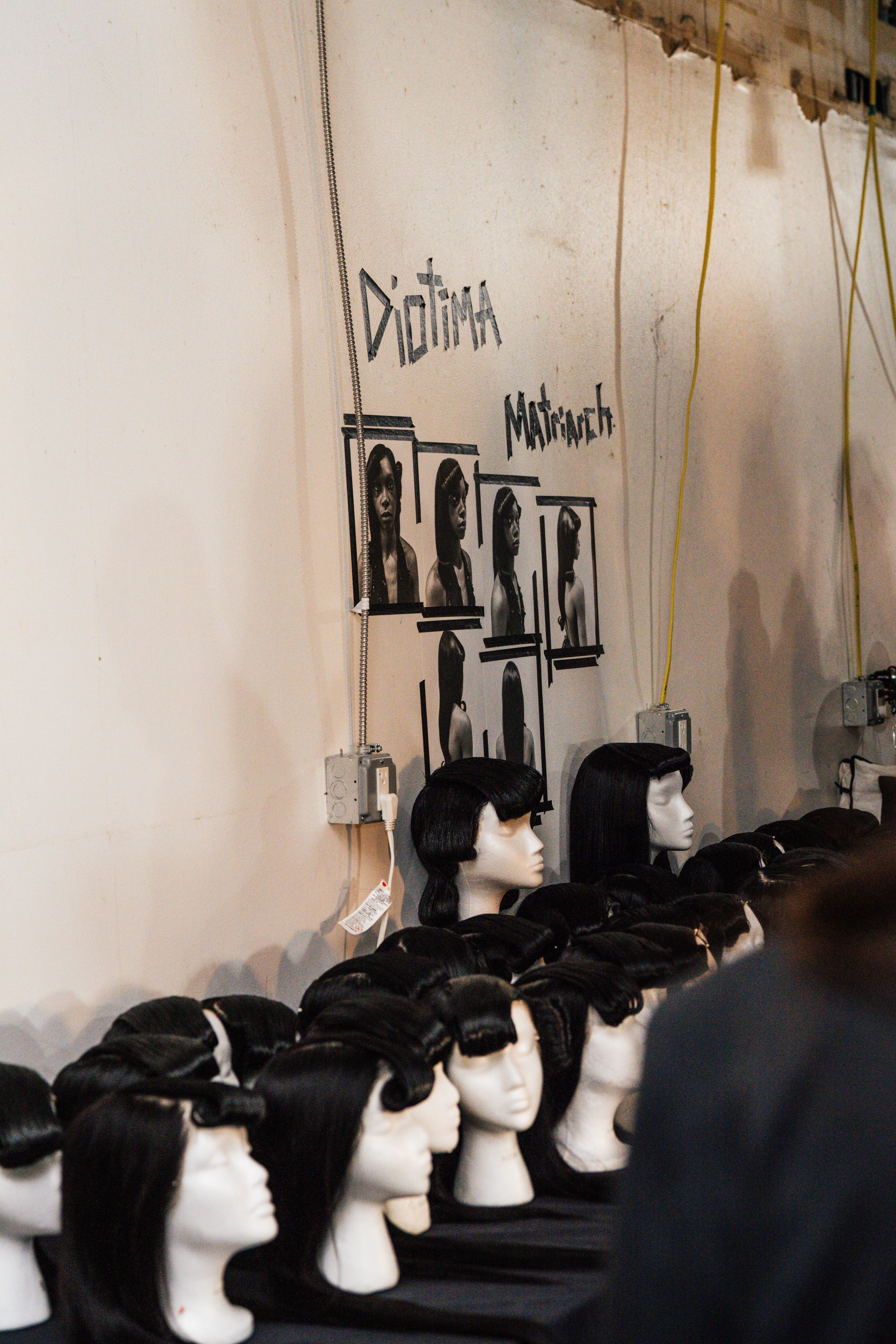Wigs on display at Diotima Fashion Show