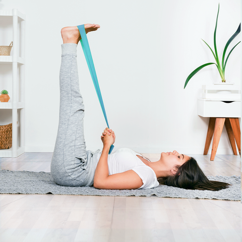 Legs-Up-The-Wall Pose (Viparita Karani). The image depict someone with their legs against the wall, arms on either side.