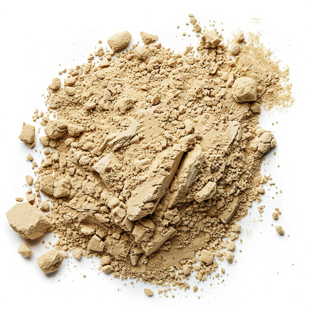 Pile of beige powder and chunks isolated on white background.