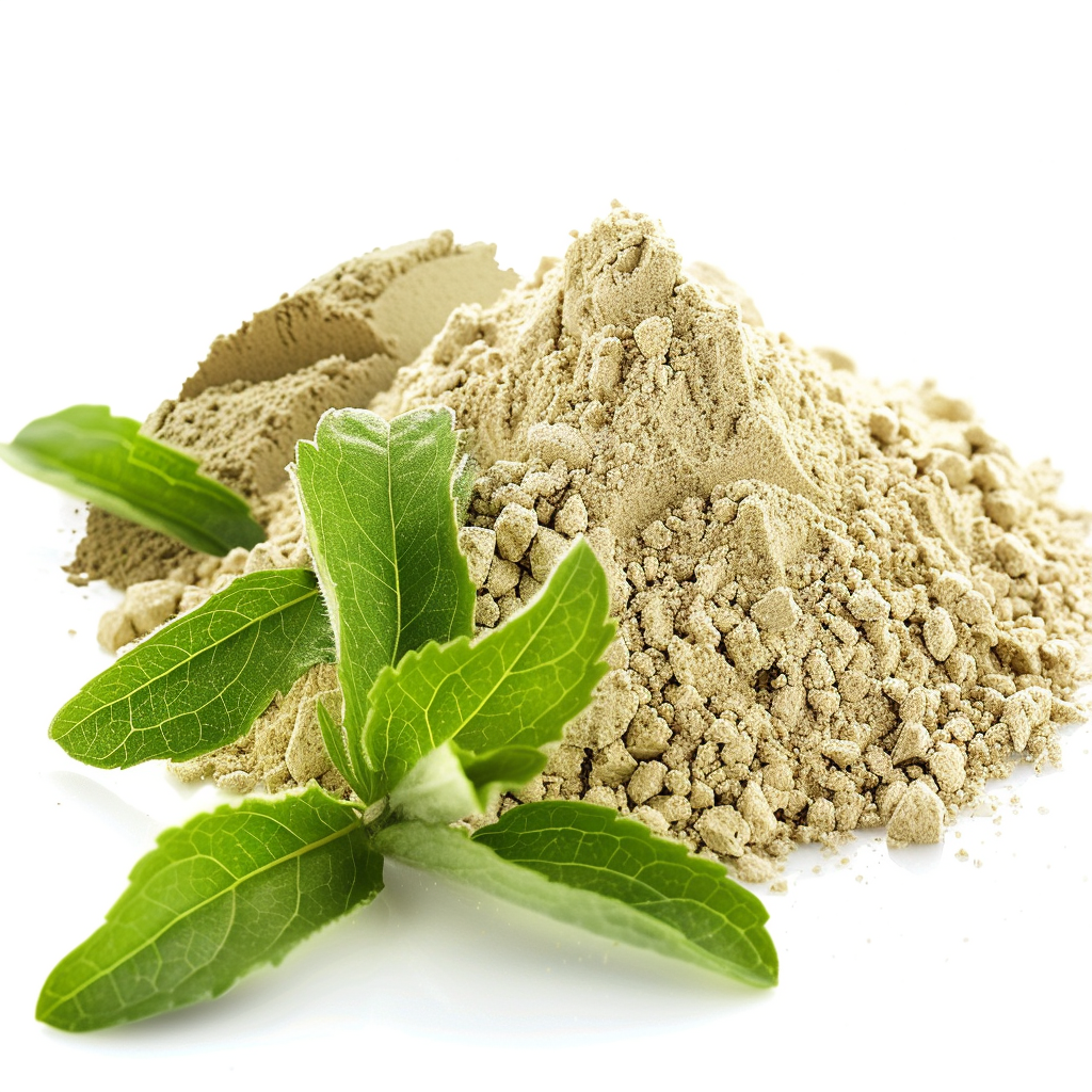 A pile of green powder with fresh leaves on a white background.