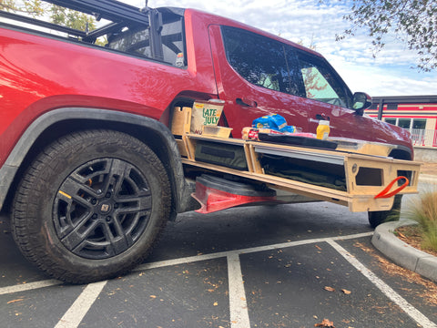 Thunderbolt Camp Kitchen and red Rivian R1T