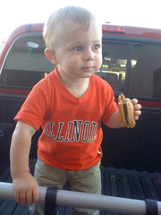 Kid in Illinois t-shirt holding a burger