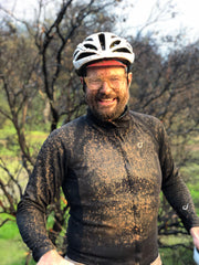 Matthew covered in mud after mountain biking