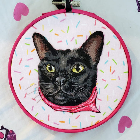 Hand embroidered black cat wearing a pink bandana