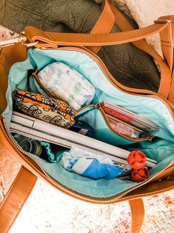 white elm brown vegan leather bag packed