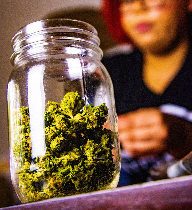 Lady on counter selling weed