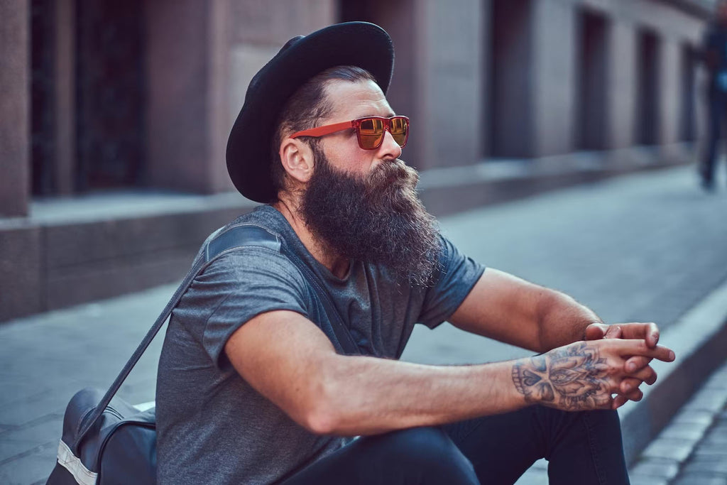 Man With Longer Beard Sitting Outside