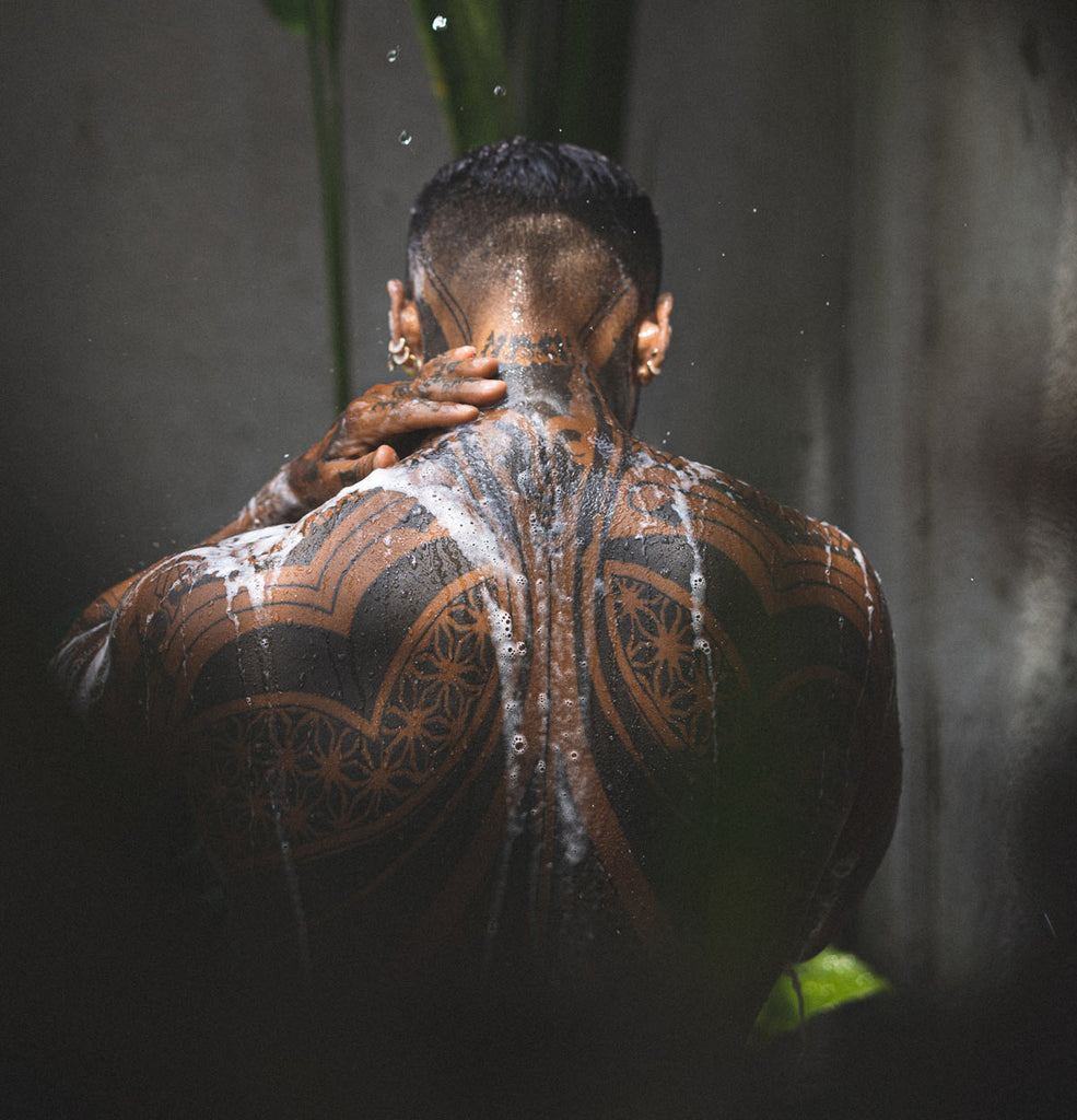 Man With Tattoos In Shower With Soap