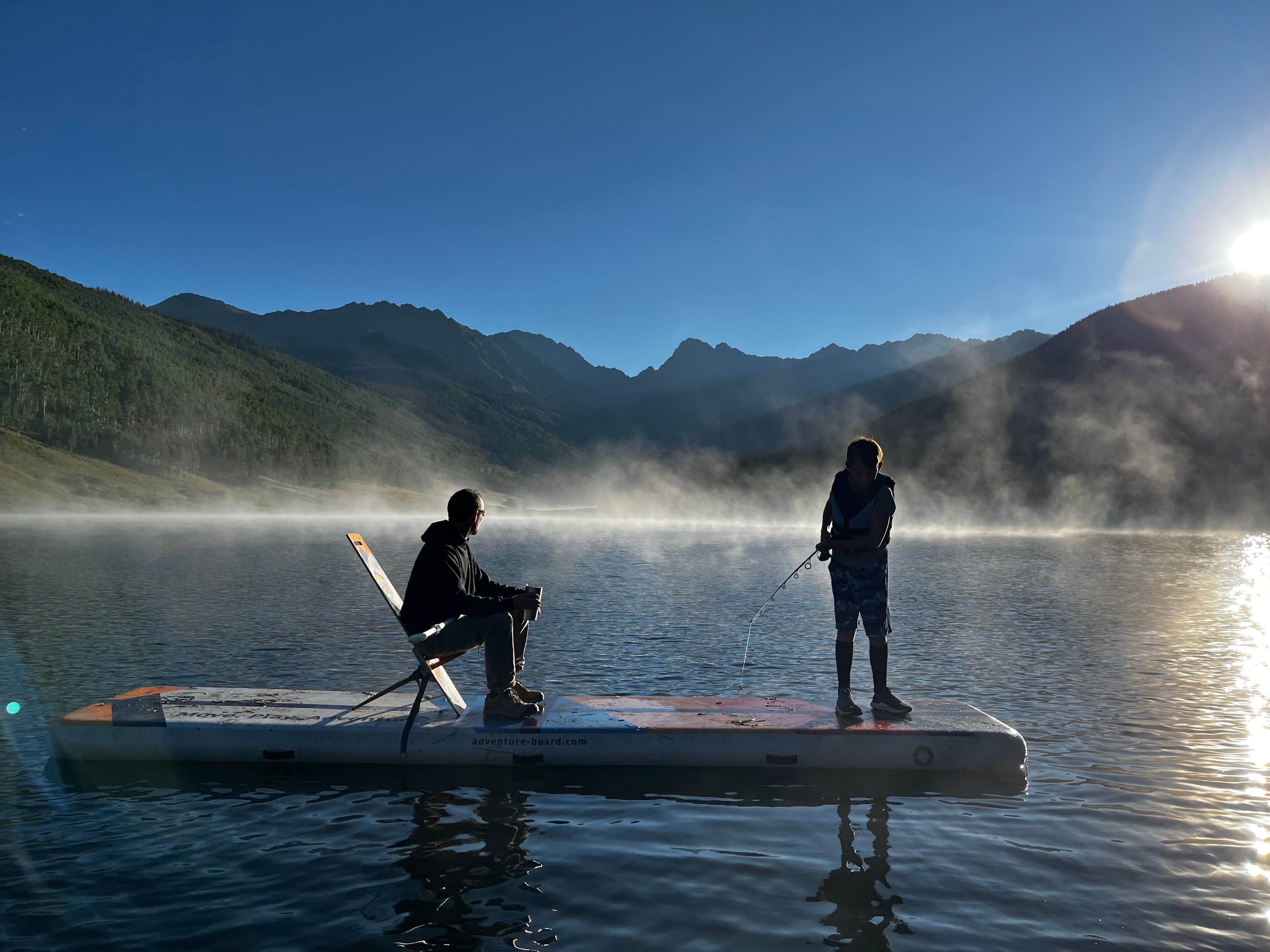 Father and Son Fishing on a Mountain Lake