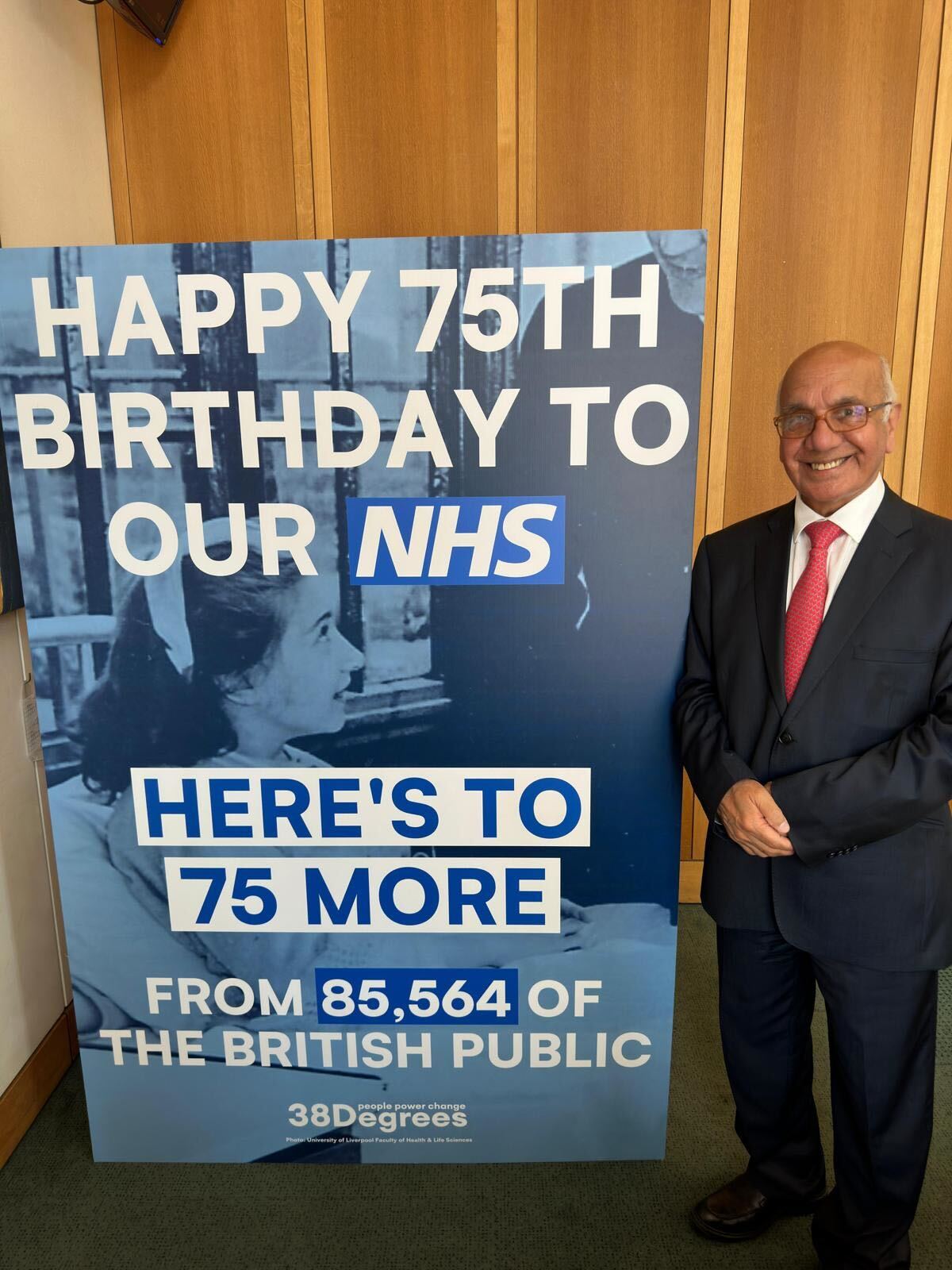 Virendra-Sharma signing nhs giant birthday card