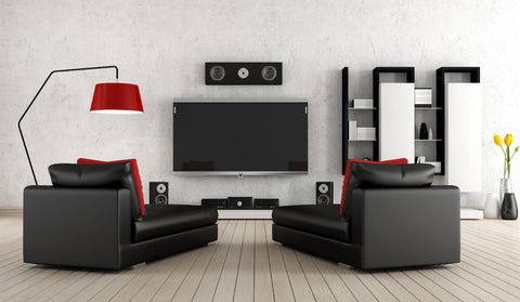 tv and speakers and two sofas in home theater 