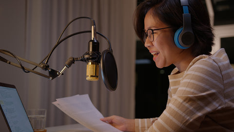 asian female podcaster recording and broadcasting