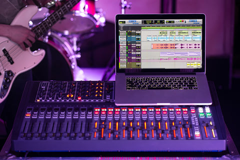 digital mixer in a recording studio with a computer