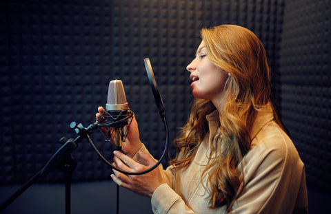 female singer sings a song recording studio
