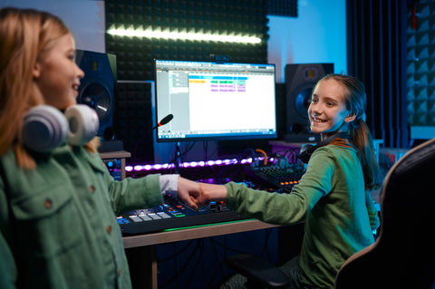 happy girls children at radio station or record studio