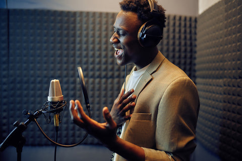 male singer sings a song recording studio