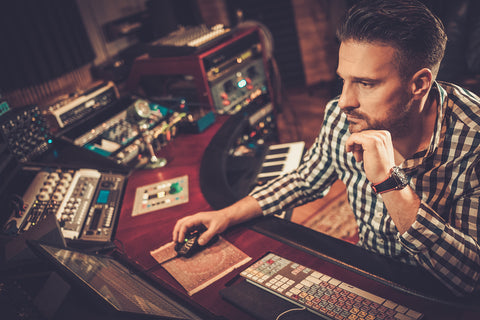 sound engineer working at mixing panel 2