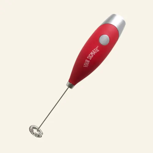 Red handheld milk frother with a silver tip and whisk.