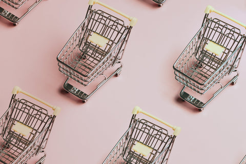 silver trolley cart with pink background
