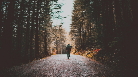 man running through woods