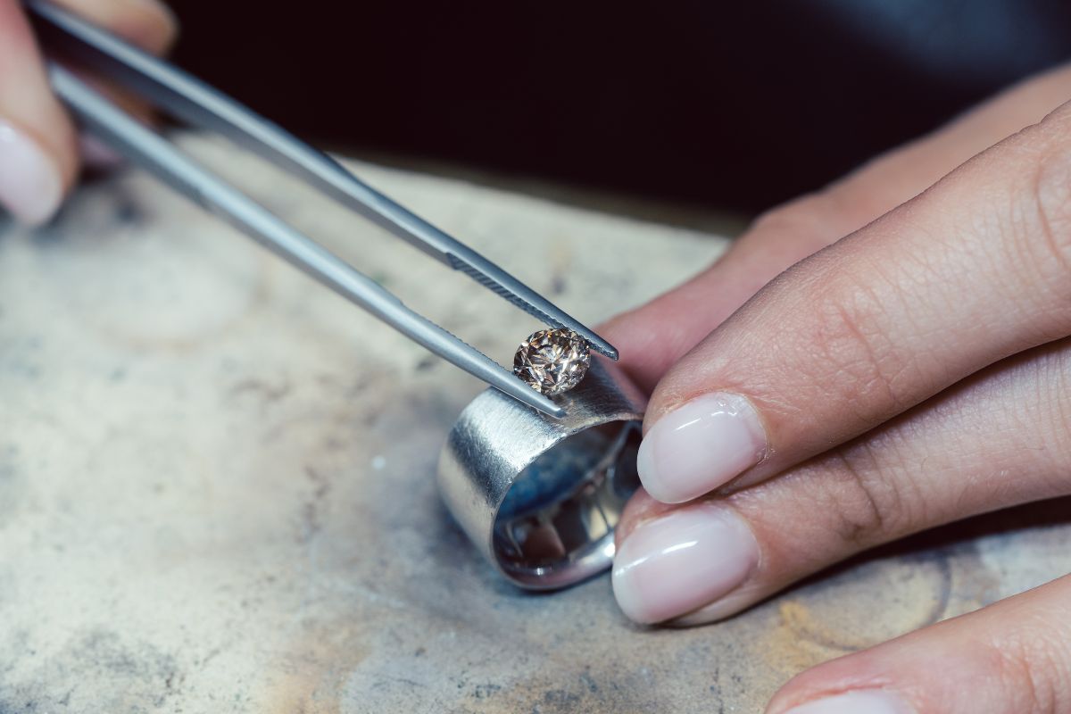 Customization of a diamond ring by adding a higher carat diamond to it.