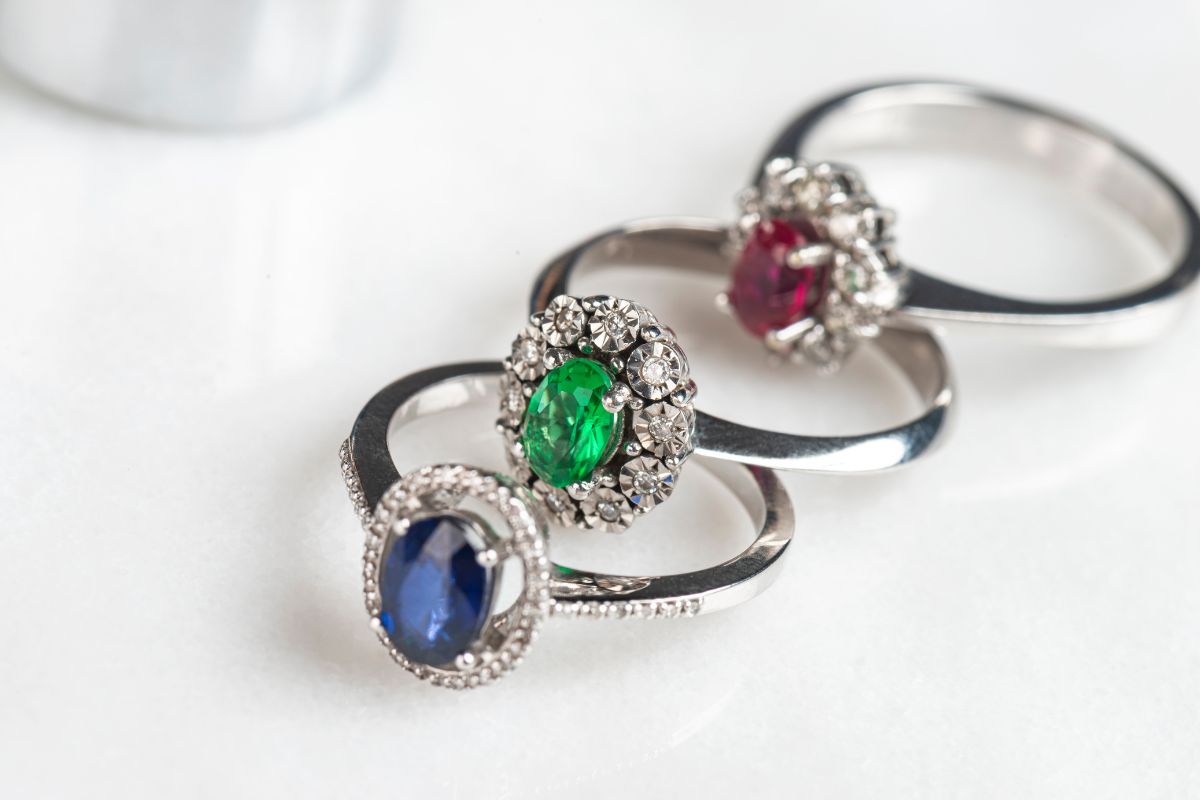 Three gemstone engagement rings kept together.