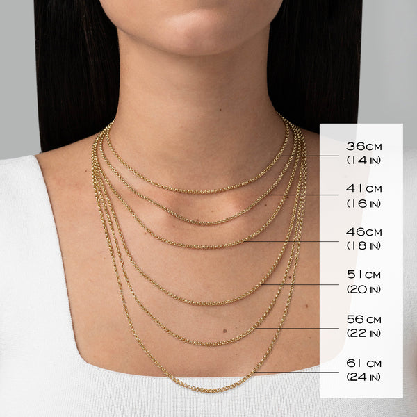 Model wearing multiple gold chains showing length of each chain