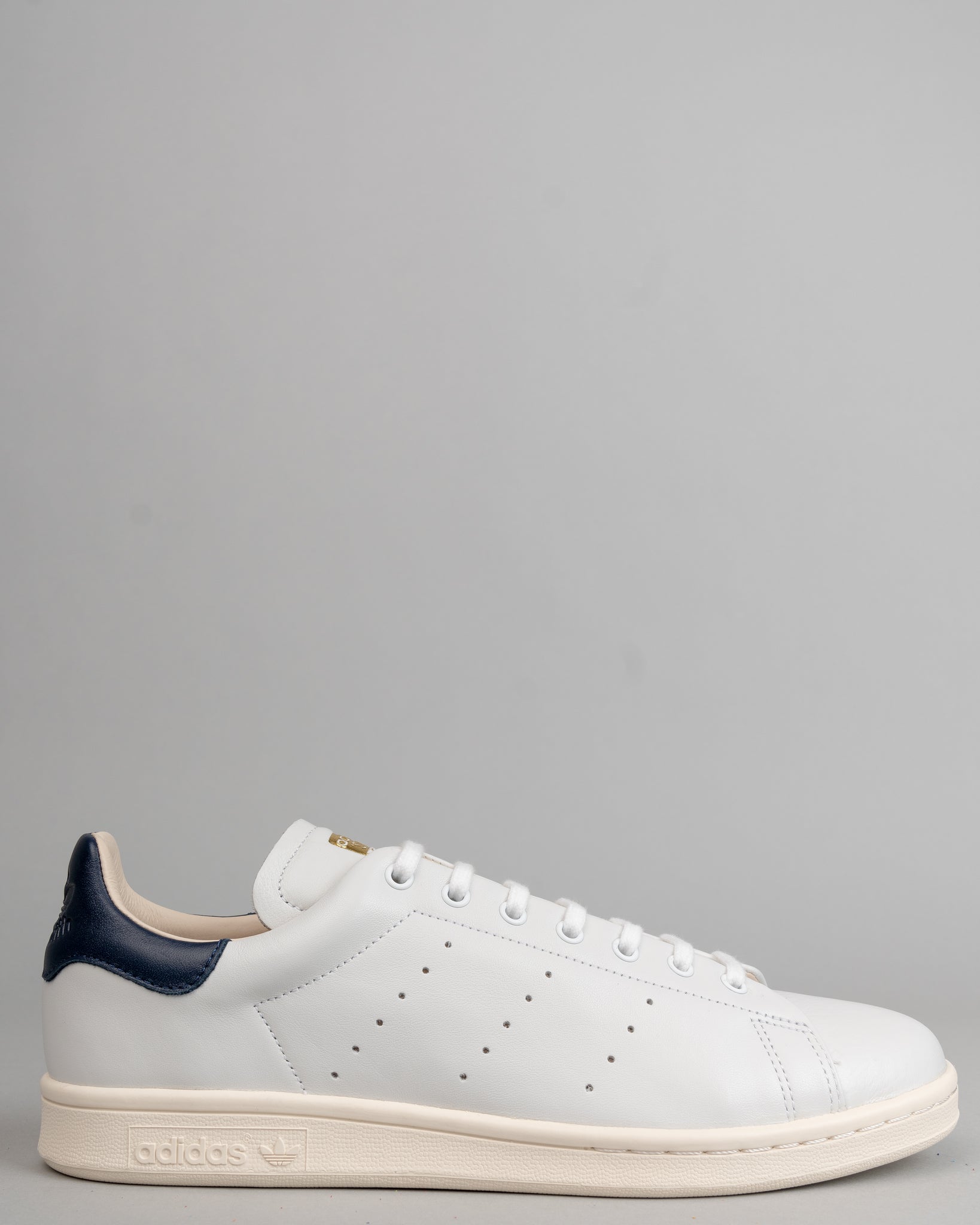 white and navy stan smith