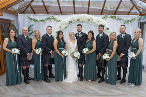 emerald green bridesmaids and groomsmen in kilts