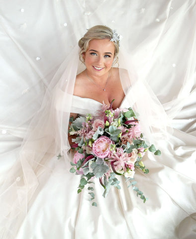 Bride with bouquet and large hair vine