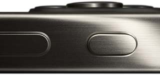 Side view of iPhone 15 Pro in a titanium design showing a volume button and Action button