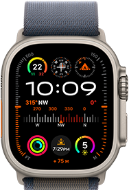 Apple Watch Ultra 2 shown attached to blue Alpine Loop, displaying watch face with complications including GPS, temperature, compass, altitude, and fitness metrics