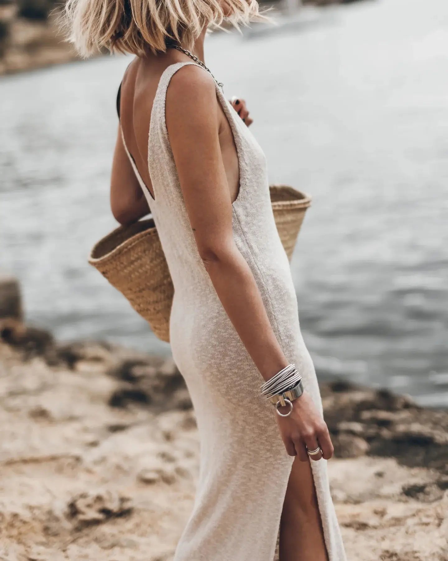 Solid color knitted midi dress with open back and loose fit - Image 7