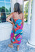 Tropical Twist Midi Dress, vibrant sleeveless dress featuring a colorful abstract print and a stylish front tie detail