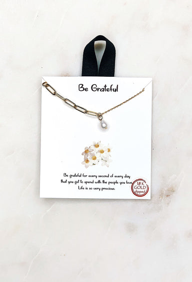 Be Grateful Gold Pearl Necklace, a pearl charm on a double chain - one side normal gold chain and the other a thicker link meeting in the middle 