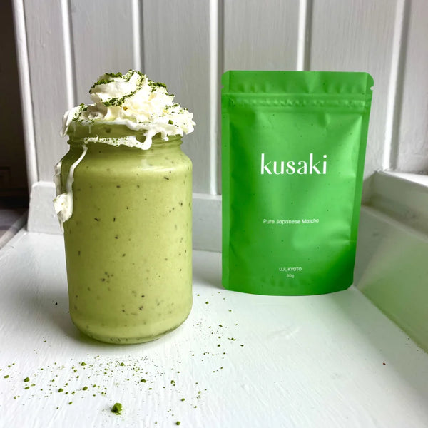 matcha smoothie in a jar shaped glass