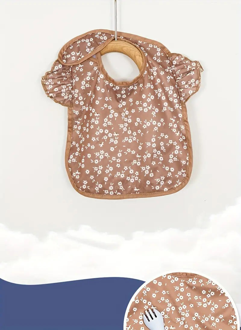 babero impermeable de fácil limpieza con cierre ajustable y gran bolsillo, detalles en tela reciclada de colores mezclados 3