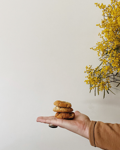 Em Reynolds hand with biscuits.