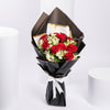 Red Roses And Alstroemeria In Black Wrapping