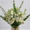 White Lisianthus Roses Bouquet With Eucalyptus In Glass Vase