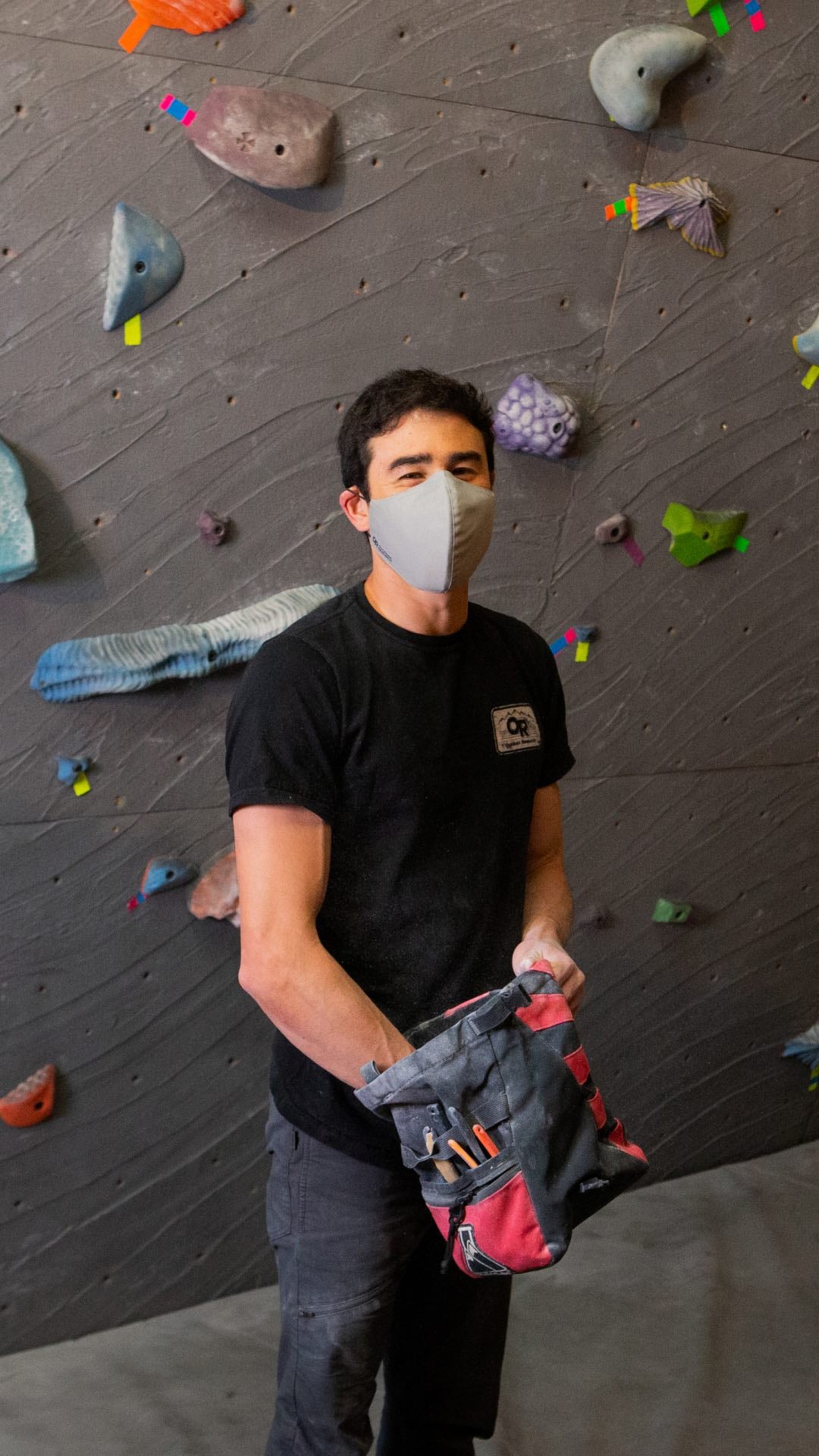 Keenan Takahashi wears the Outdoor Research Essential Face Mask while bouldering. 