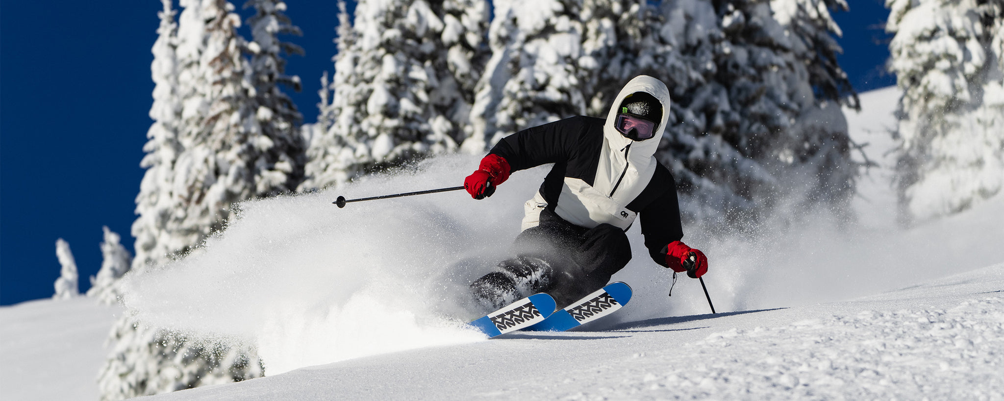 Outdoor Research Ambassador Troy Podmilsak wears the Snowcrew Anorak in Black/Snow.