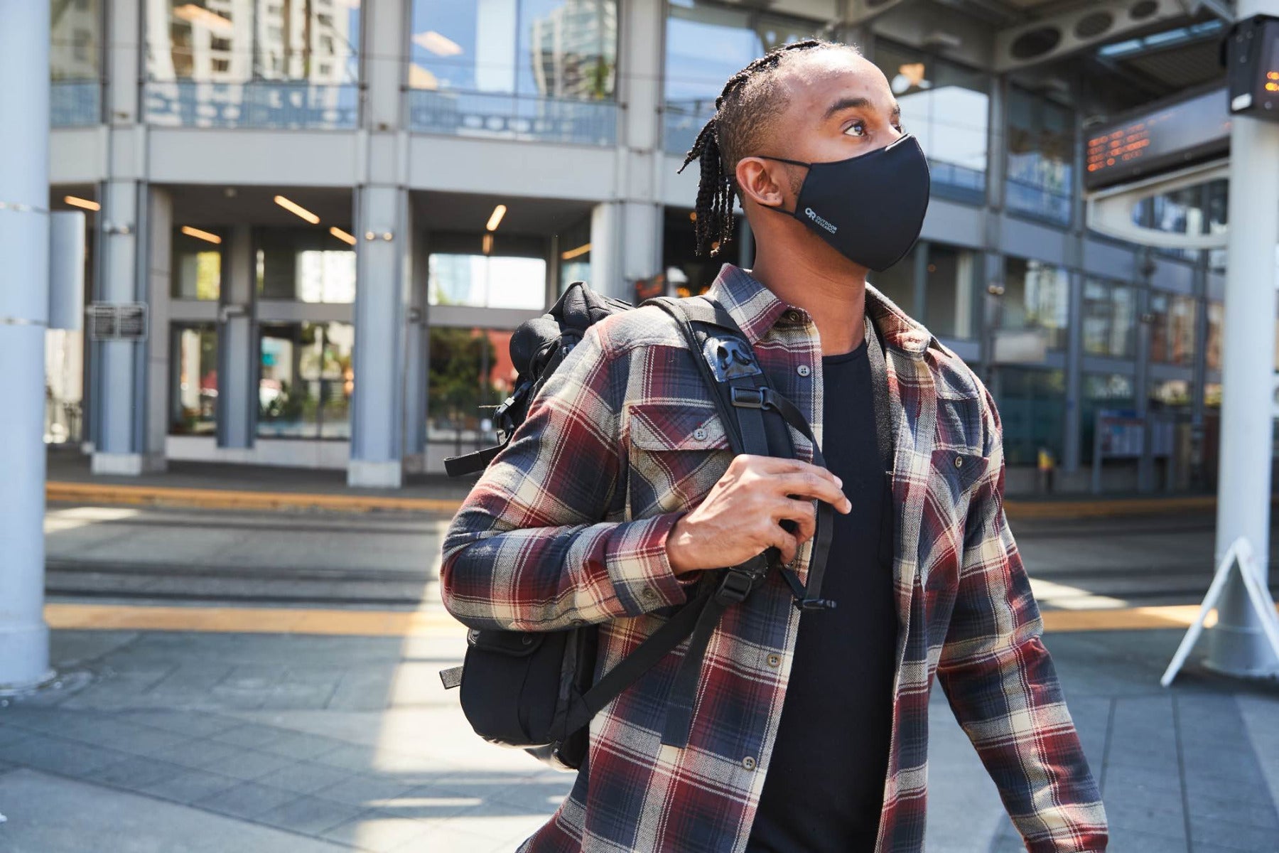 A commuter wears the Outdoor Research Face Mask Kit.