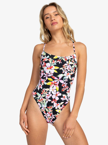 Blonde model wearing Roxy Beach Classics one piece swimwear in anthracite new life colourway