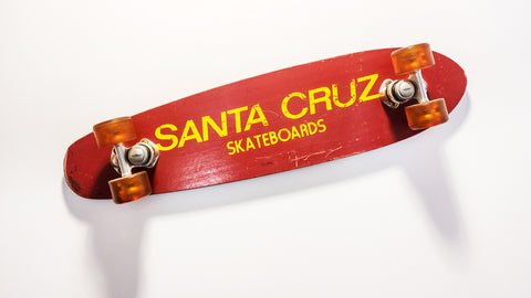 Old style red Santa Cruz skateboard