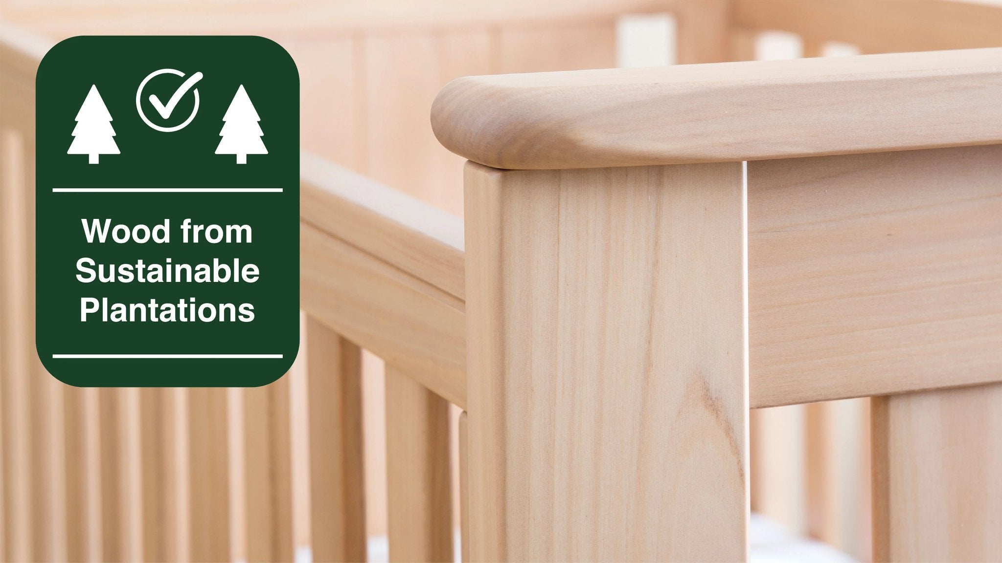 solid wood cot with sustainability logo