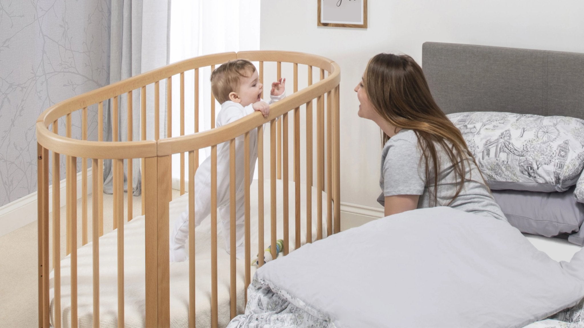 oval cot at mothers bedside